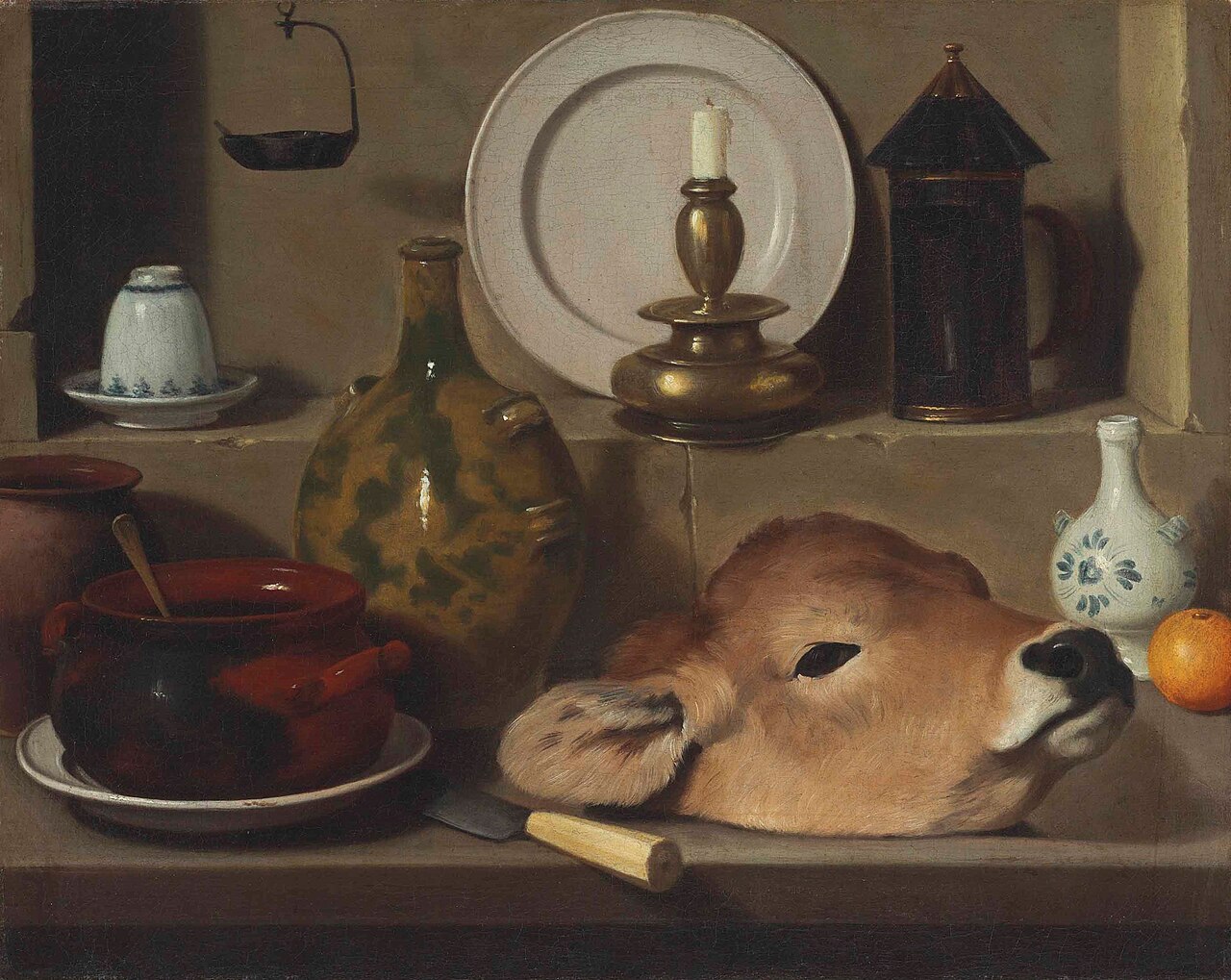 An oil lamp, ceramics, brass lantern, knife, onion and calf's head by Carlo Magini