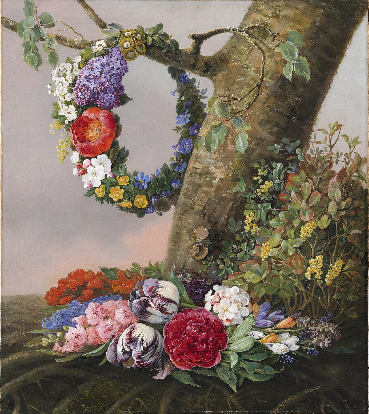 A bouquet of flowers at the foot of a tree. At a branch hangs a garland by Christine Løvmand