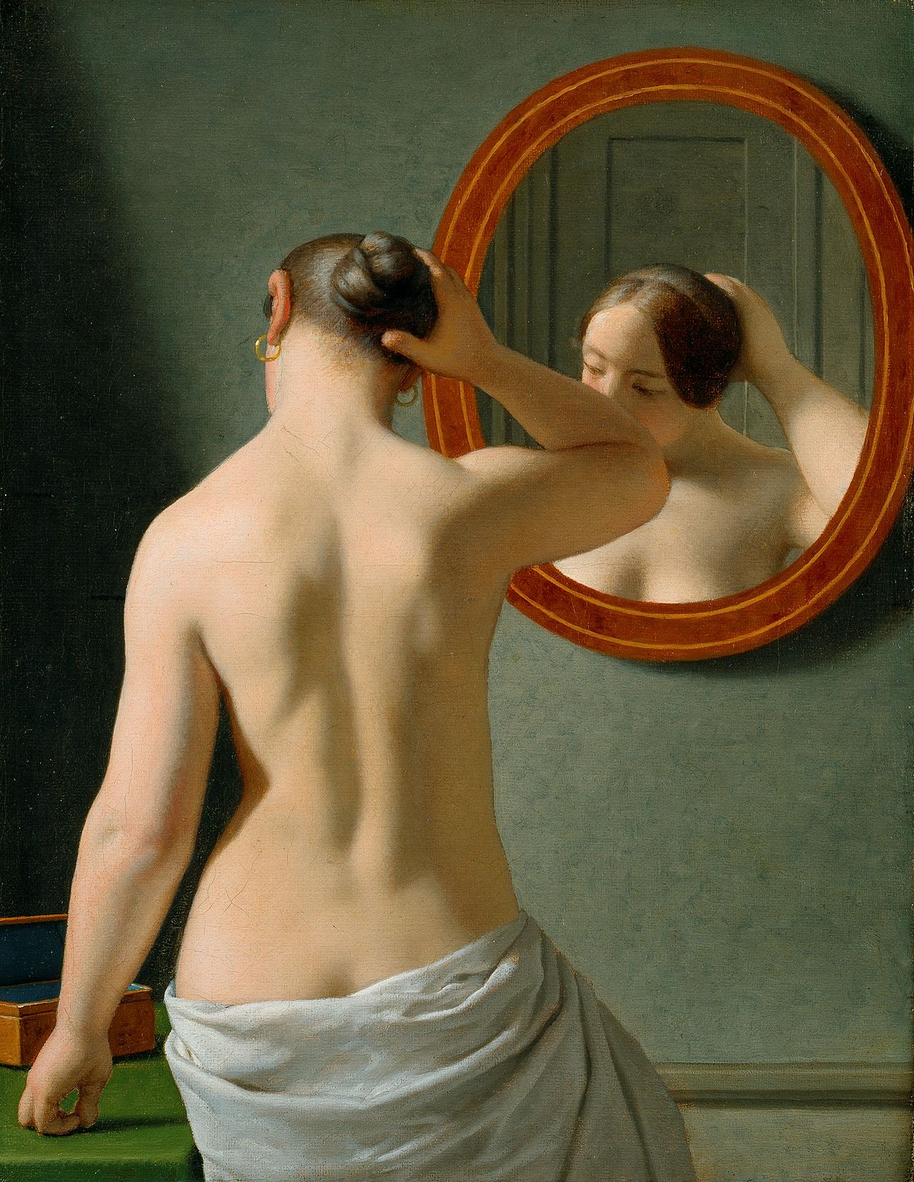 A nude woman doing her hair before a mirror by Christoffer Wilhelm Eckersberg