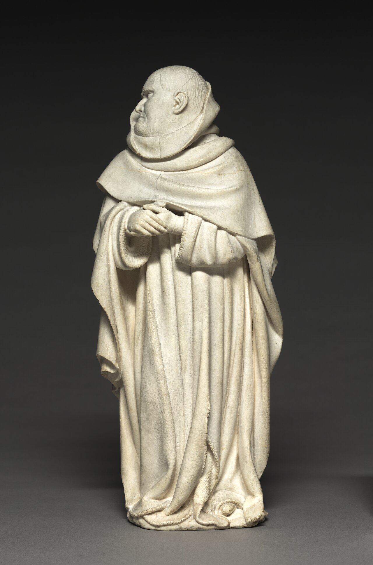 Mourner from the Tomb of Philip the Bold, Duke of Burgundy (1364–1404) by Claus de Werve