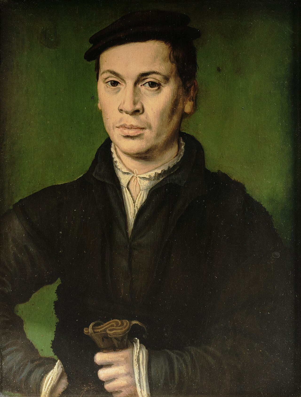 Man in black beret holding a pair of gloves by Corneille de Lyon