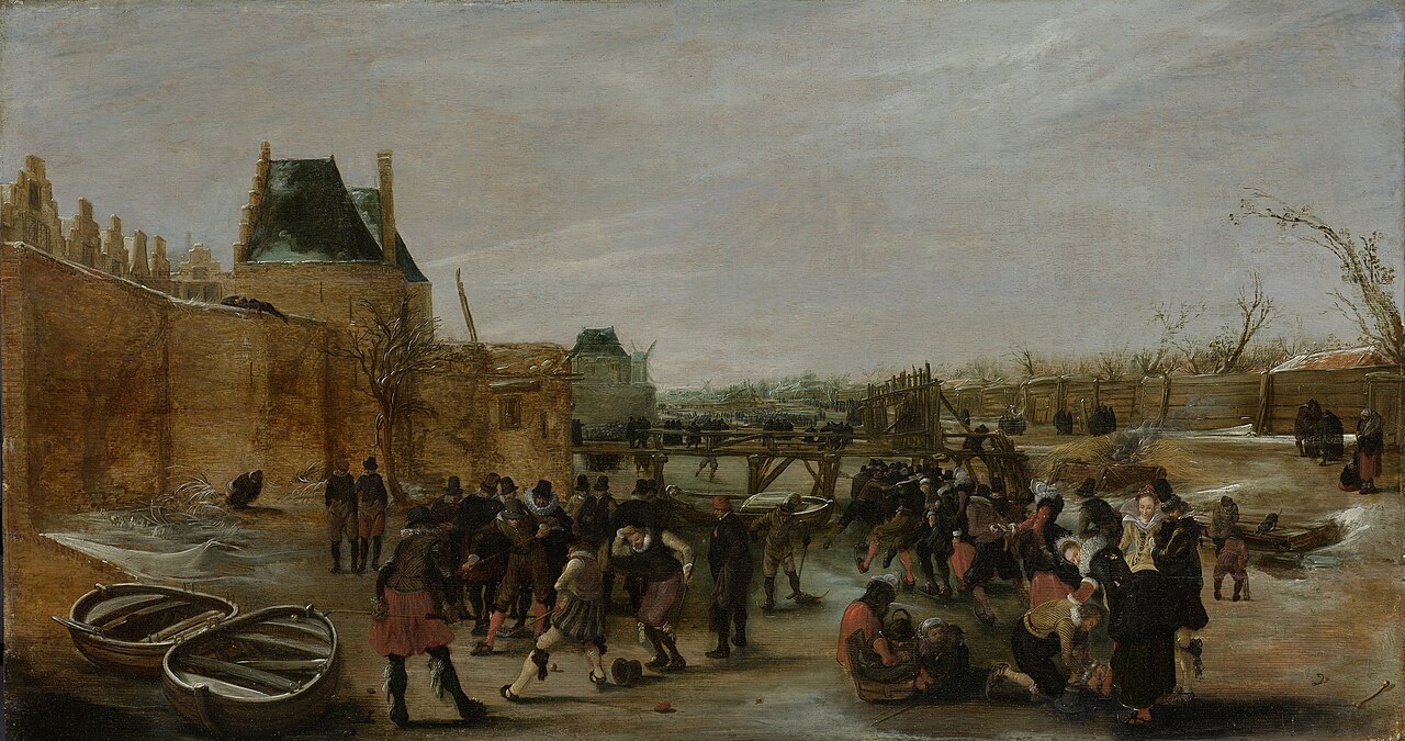 Frolicking on a frozen canal in a town by Hendrick Avercamp