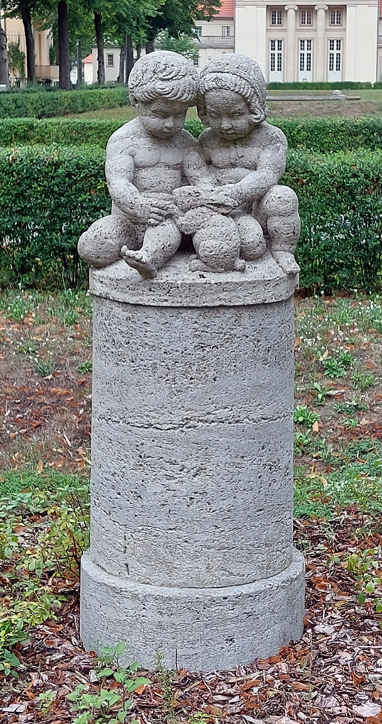 Boy and girl with rabbit and dog by Ignatius Taschner