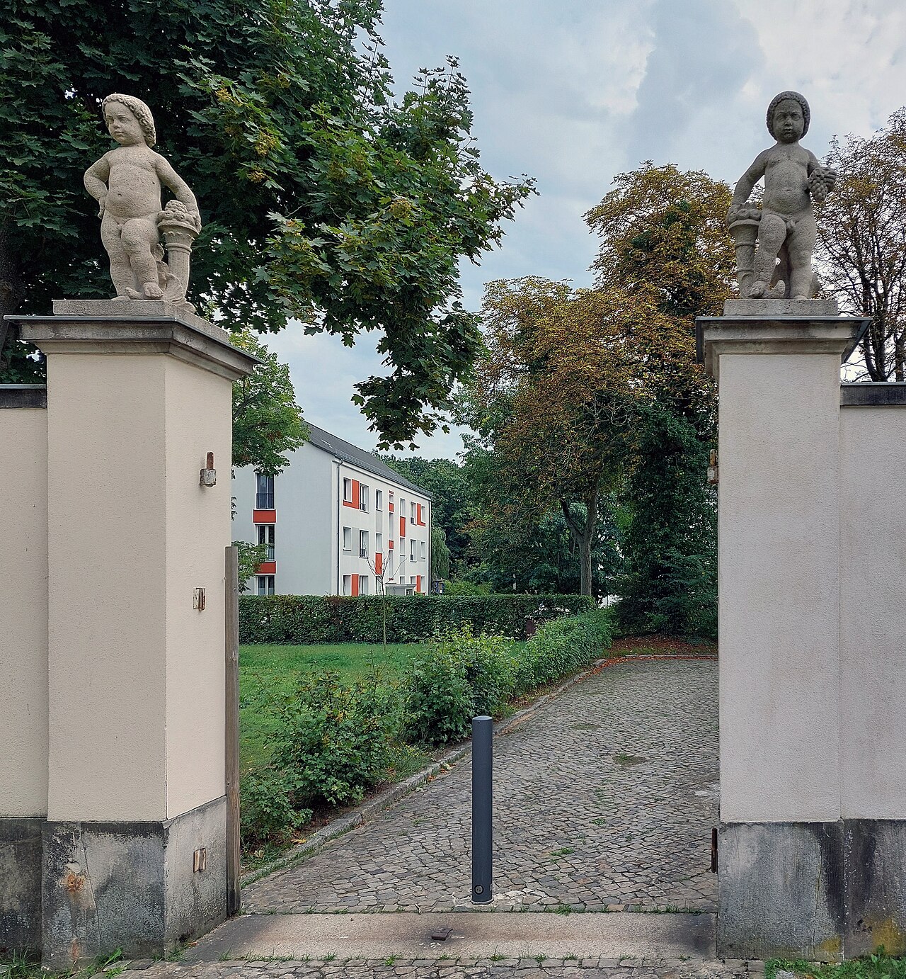Standing boys with cornucopias by Ignatius Taschner