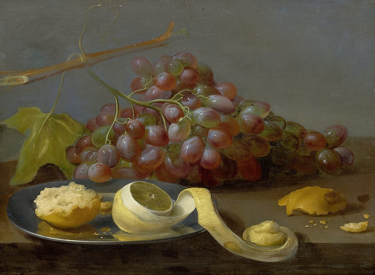 Still life with grapes, a lemon and bread on a table by Jacob van Es