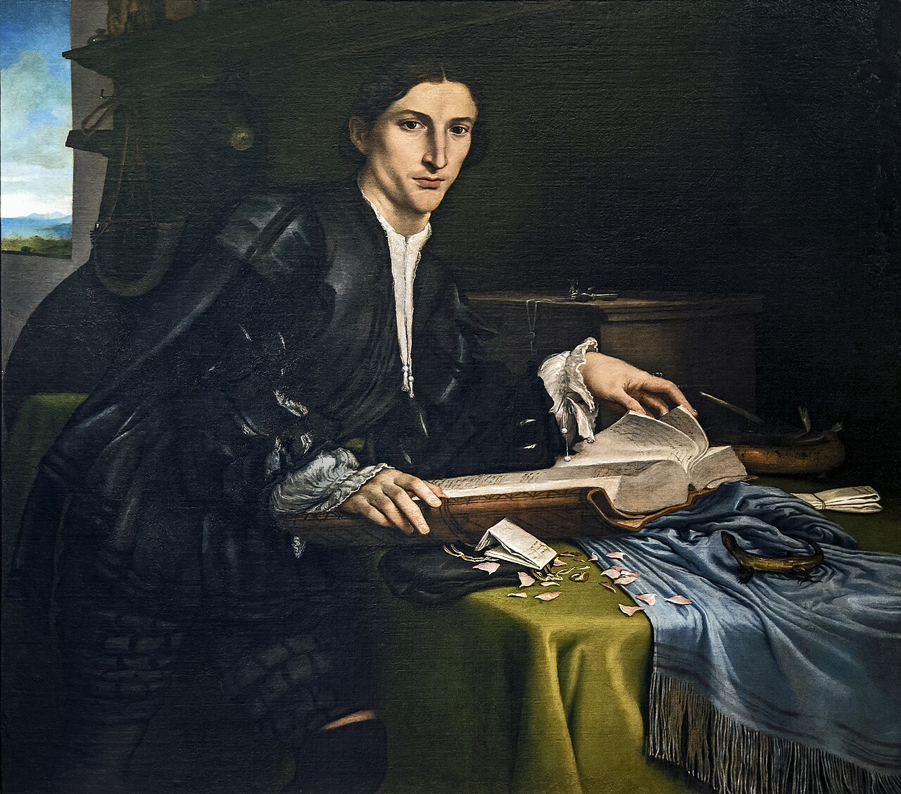 Portrait of a gentleman in his studio by Lorenzo Lotto