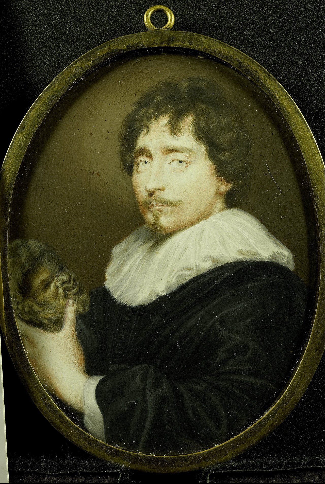 Portrait of a man with a sculpture of a head of Silenus in his hand by Peter Oliver