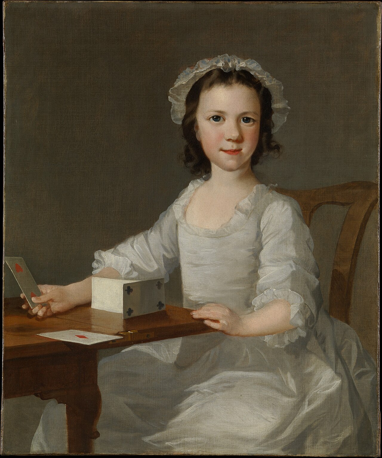 Girl Building a House of Cards by Thomas Frye