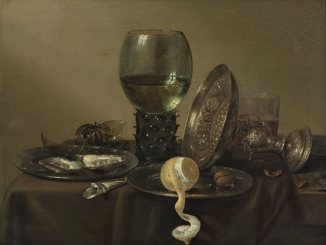 Still life with oysters, a rummer, a lemon and a silver bowl by Willem Claesz. Heda